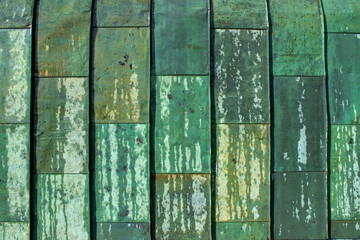 Close up of green wet copper wall