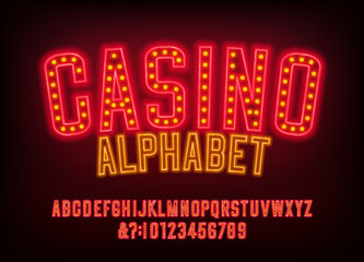 Casino alphabet font. Glowing neon letters, numbers and symbols. Stock vector typeface for your design.
