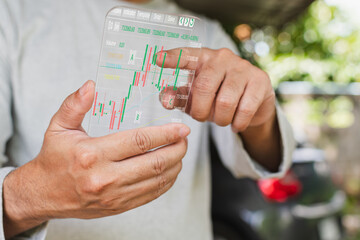 professional businessman doing trading stock at home, virtual screen display graph report for analysis growth stock to planning and decision to high profit to success corporate, light style, holiday