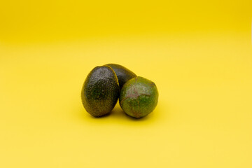 avocado on yellow background