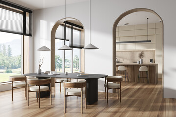 Stylish kitchen interior with dining and cooking zone, panoramic window
