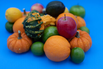 Colorful Fruits and Vegetables on a Vibrant Blue Backgrund