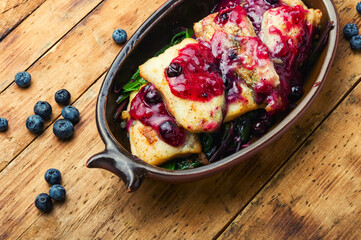 Baked pangasius fish with blueberries