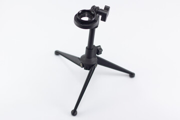 closeup black mini stand for micrphone, isolate at white background, you can put the microphone at the adjustable hole