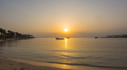 waves at the beach during wam sunset on vacation