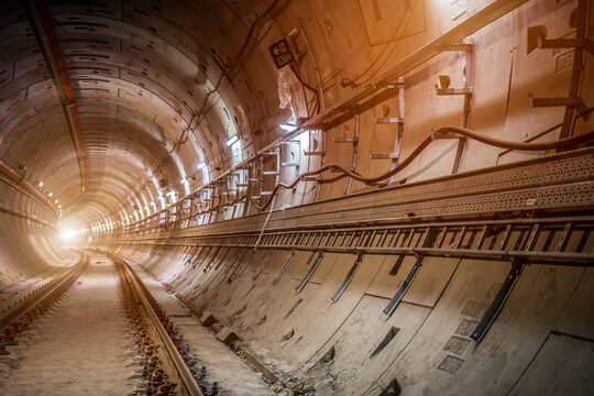 Fototapeta Soft focus and blurred lighting background of Underground tunnel infrastructure.Transport pipeline by Tunnel Boring Machine for electric train subway .