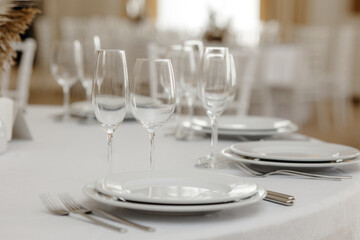 Served dinner table in a restaurant. Restaurant interior, table setting for a dinner, table set for a dinner.