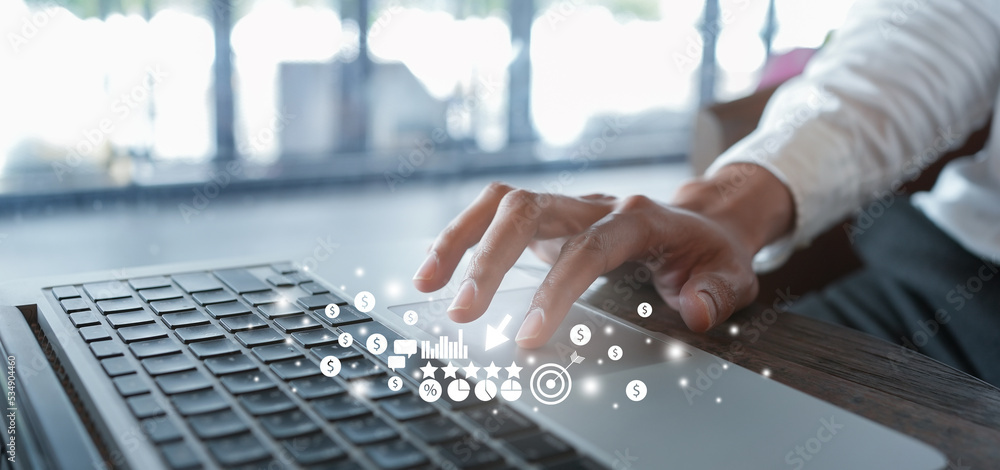 Wall mural close up businessman hand click on laptop to use marketing tool and check traffic research of pay pe