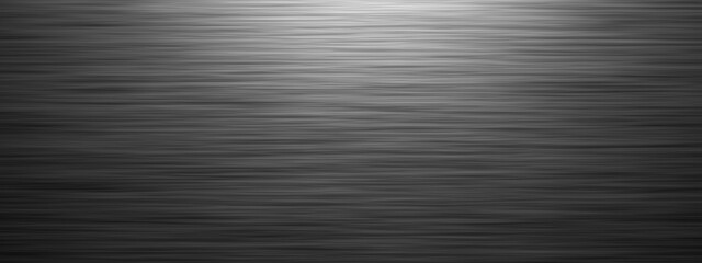 Brushed gray metal background, horizontal widescreen material wallpaper with lighting effect from above and copy space for text