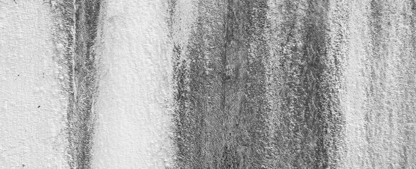 Streaks on a Pale White Plaster Wall. Rustic background. Panoramic Photo. Black and white