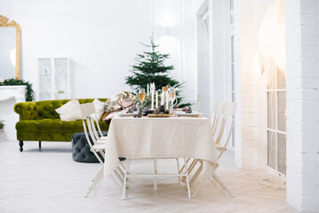 Cozy classic table for celebrating Christmas or New Year in a Scandinavian style.