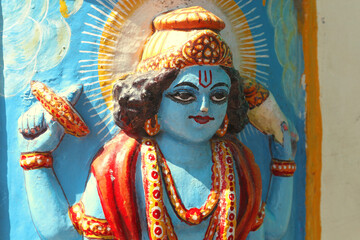 Vishnu on the wall of the temple in Rishikesh.