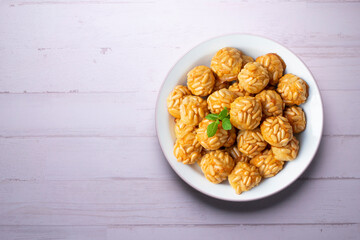 Pine nut penelles. Traditional autumn recipe for desserts made with marzipan in Barcelona