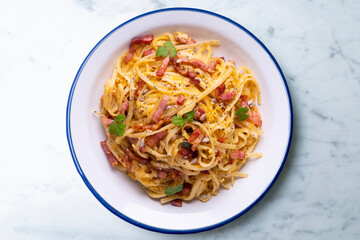 Spaghetti a la cardinale. Pasta cooked with cream and bacon. Traditional Italian recipe.