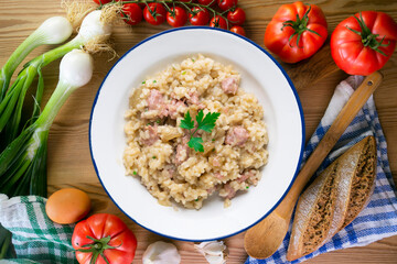 Catalan butifarra sausage risotto with parmesan. Mixed Spanish and Italian recipe.