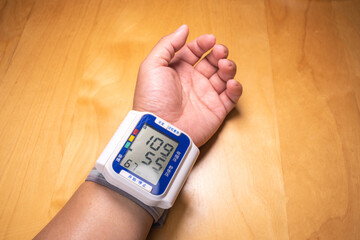 Man is examining blood pressure. High blood pressure.