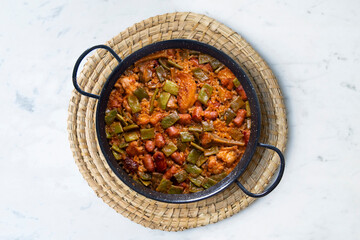 Paella with green beans and sausages. Typical Spanish paella tapa recipe with meat.