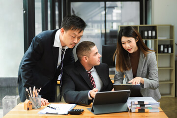 Young business creative team are brainstorming planning discussing while sitting in creative business discussing work in office