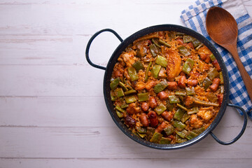Paella with green beans and sausages. Typical Spanish paella tapa recipe with meat.