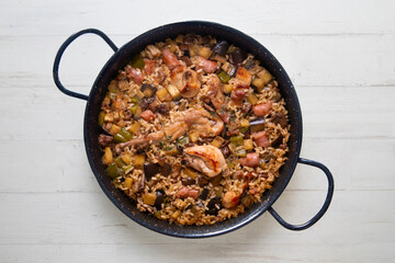 Rabbit and sausage paella. Typical Spanish paella tapa recipe with meat.