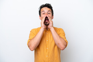 Young man with moustache isolated on white background shouting and announcing something