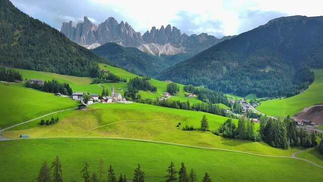 Amazing nature landscape in the Italian Alps. Wonderful summer view of St. Valentin Church on alpine meadow in Kastelruth. Location Dolomites,