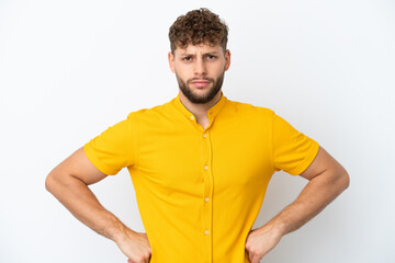 Young handsome caucasian man isolated on white background angry