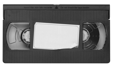 Old vintage vhs video cassette tape with a blank paper label. Magnetic videotape movie storage - obrazy, fototapety, plakaty