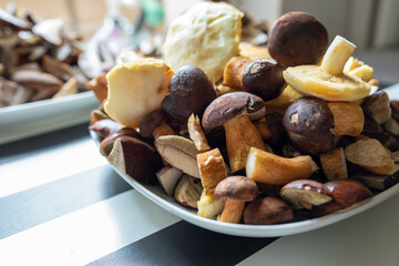 plates full of cleaned, sliced, colored mushrooms. Bay bolete, larch bolete, slippery jack, orange birch bolete.