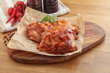 Marinated chicken leg in tomato sauce