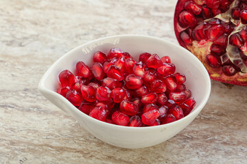 Ripe red Pomegranate seeds in the bowl