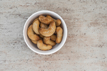 Hot cookies in a plate on a ceramic tile.
