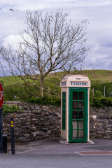 Old Irish phone booth, public payphone in ireland