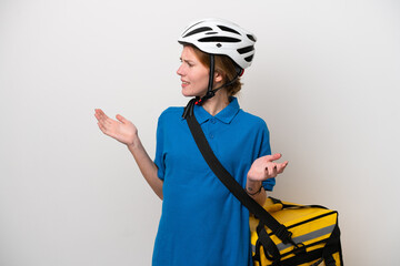 Young English woman with thermal backpack isolated on white background with surprise expression while looking side