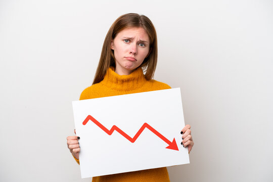 Young English woman isolated on white background holding a sign with a decreasing statistics arrow symbol with sad expression