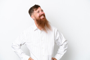Redhead man with long beard isolated on white background posing with arms at hip and smiling