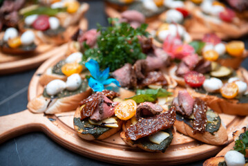 Toasted sandwiches with meat, vegetables, quail eggs, and lettuce