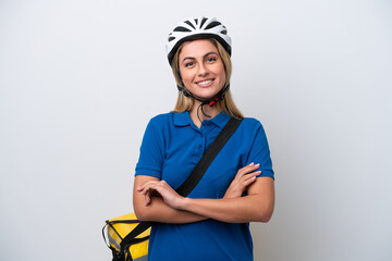 Young caucasian woman with thermal backpack isolated on white background keeping the arms crossed in frontal position