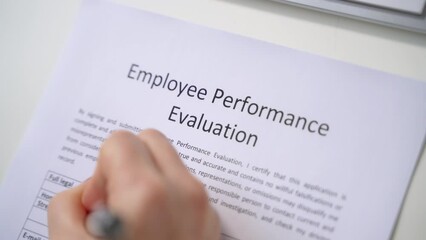 Person Filling A Performance Evaluation Form