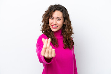 Young caucasian woman isolated on white background making money gesture