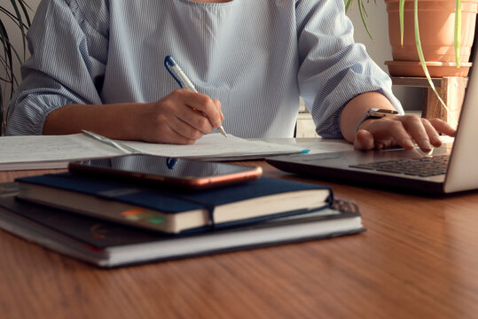 Young Woman Counting Utility Bills