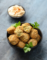 Middle Eastern vegetarian vegan chickpea and coriander falafels served with hummus