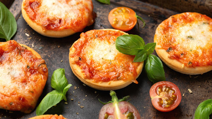 Mini pizzas with tomatoes and mozzarella cheese