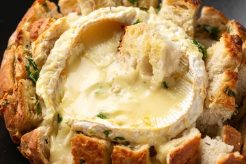 Wall murals Bread Baked Camembert cheese in sourdough bread with rosemary, garlic, thyme