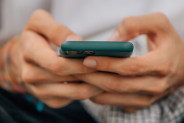 closeup of hands with mobile phone or smartphone