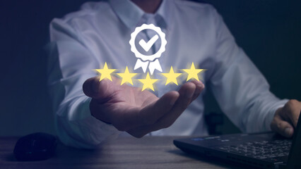 Businessman's hand showing 5 star quality assurance, leading service, warranty, standard, ISO certification and standard concept.
