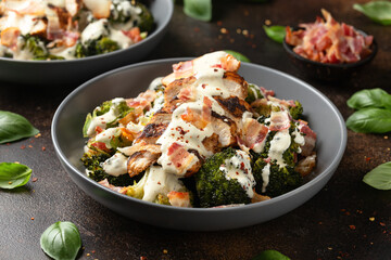 Baked chicken, broccoli with creamy cheese sauce and bacon