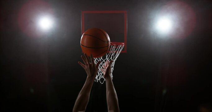 Super slow motion of basketball player hitting the basket. Filmed on high speed cinema camera Phantom, 1000fps.