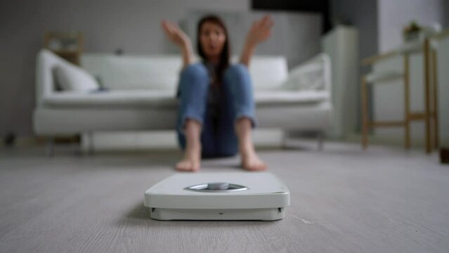 Sad Woman On Weight Scale After Diet