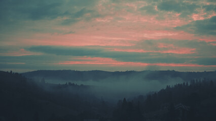 Fototapeta premium Carpathian mountains with fog at dawn